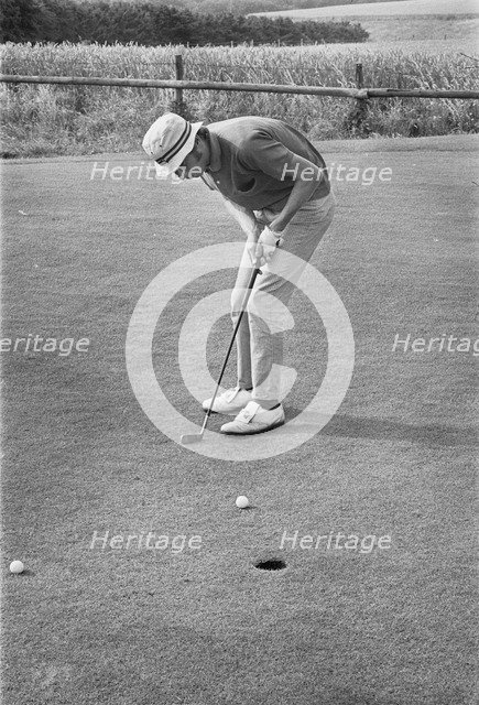Golfer putting, Sweden, 1969. Artist: Unknown