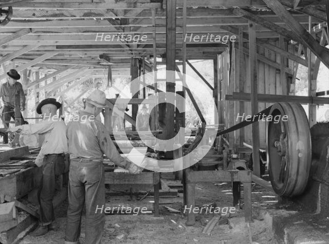 The sawmill in operation...Ola self-help sawmill co-op, Gem County, Idaho, 1939. Creator: Dorothea Lange.