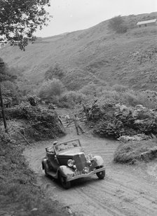 1934 Ford V8 tourer taking part in a motoring trial, late 1930s. Artist: Bill Brunell.