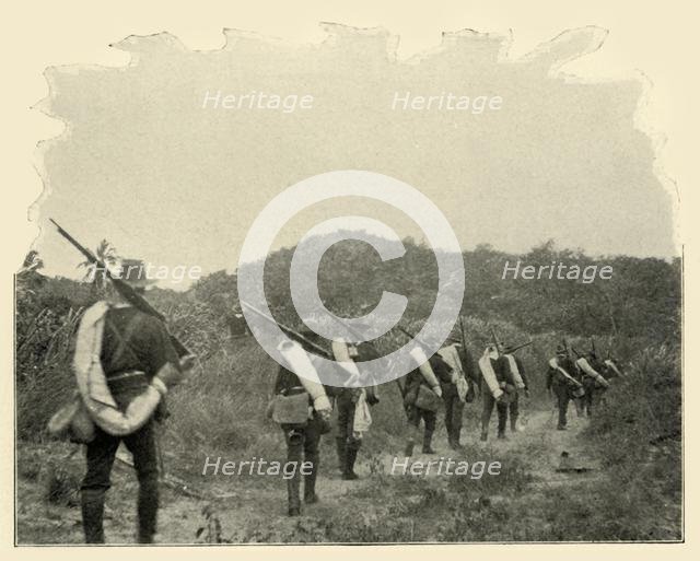 'On the Way from Battlefield of 1st and 10th to "Rough Riders" Scene of Conflict, over the Mountains Creator: Burr McIntosh.