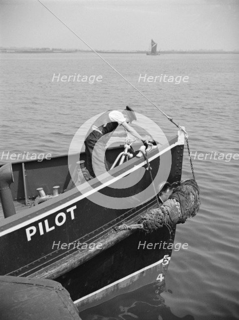A man working on the bow of a River Thames pilot boat, c1945-c1965. Artist: SW Rawlings