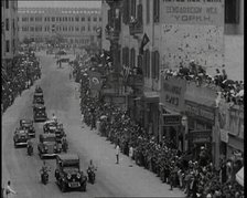 Crowds Watching a Convoy Driving Through the Streets, 1936. Creator: British Pathe Ltd.