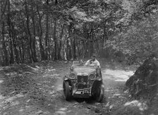 MG Magna competing in the B&HMC Brighton-Beer Trial, Fingle Bridge Hill, Devon, 1934. Artist: Bill Brunell.