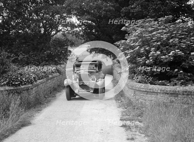 Kitty Brunell road testing a 1931 Delage D8. Artist: Bill Brunell.