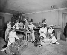 Packing socks for the troops, Westminster Palace Hotel, Westminster, London, 1915. Artist: H Bedford Lemere.