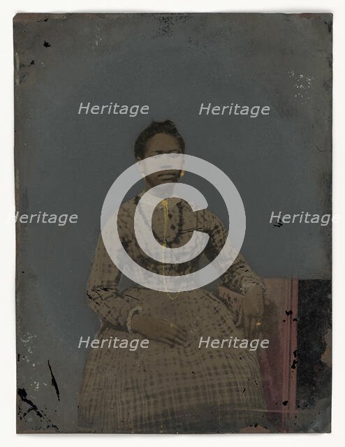 Tintype of a seated young woman, 1850-1875. Creator: Unknown.