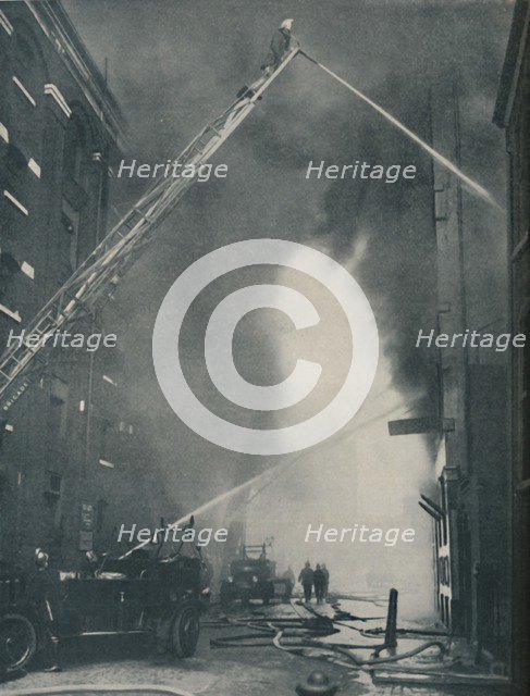 'Massed Forces of the Modern Fire-Fighter Pitted Against a City Blaze', c1935. Artist: Unknown.