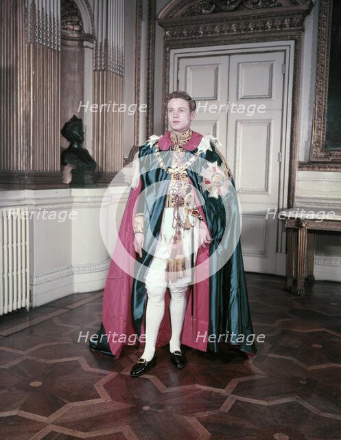 A model wearing the mantle and insignia of the Order of St Michael and St George, c1950s. Creator: Arthur Charles Kirby Ware.