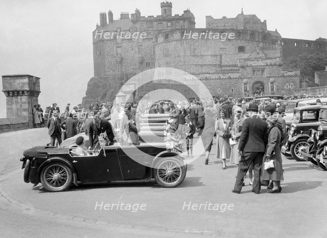 Kitty Brunell and her MG Magna on Castle Esplanade, Edinburgh, RSAC Scottish Rally, 1932. Artist: Bill Brunell.