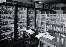 The Wellcome Building, Euston Road, London: working area in the materia medica stores, c1930s.. Creator: Unknown.
