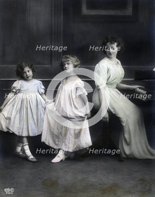 Woman at a piano with her daughters, Sweden, late 19th-early 20th century. Artist: Unknown