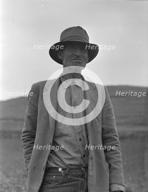 This man is a labor contractor in the pea fields of California, 1936. Creator: Dorothea Lange.