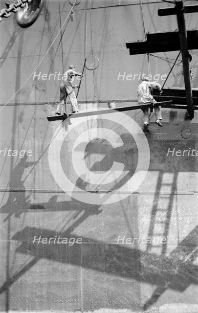 Two men painting a ship in the Royal Albert Dock, Canning Town, London, c1945-c1965. Artist: SW Rawlings