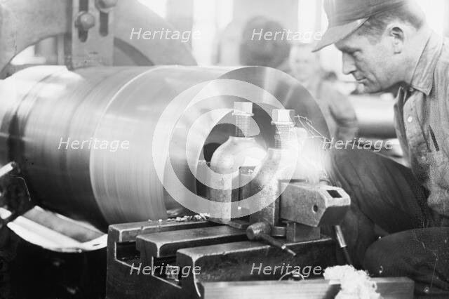 Navy Yard, U.S., Washington - Turning, Examining And Boring A 5 Inch, 50 Cal. Gun, 1917. Creator: Harris & Ewing.