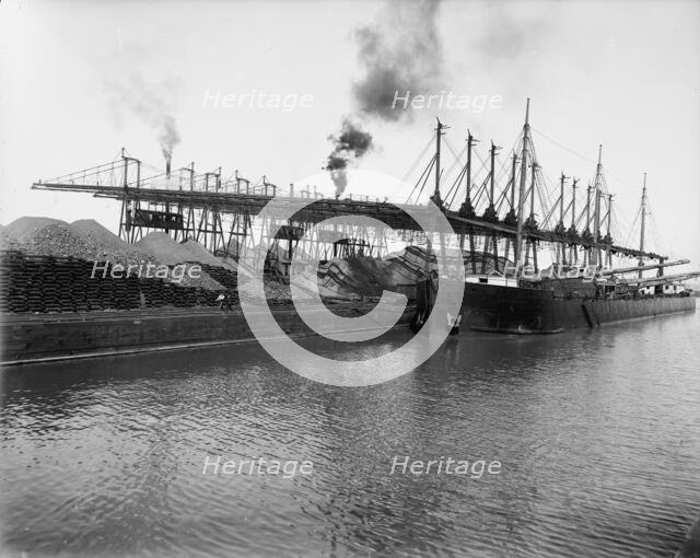 Unloading ore at L.S. & M.S. [Lake Shore & Michigan Southern] Ry. Co.'s docks, Ashtabula, Ohio,c1900 Creator: Unknown.