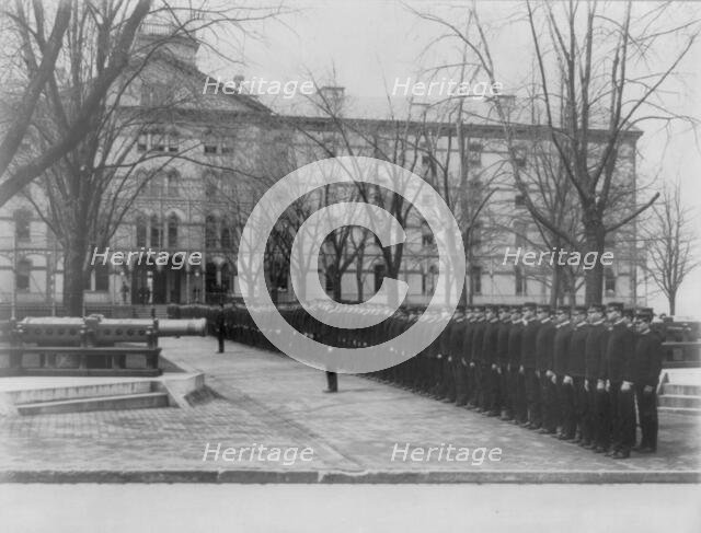 U.S. Naval Academy, Annapolis Md.: cadets lined up in row leading to building, (1902?). Creator: Frances Benjamin Johnston.