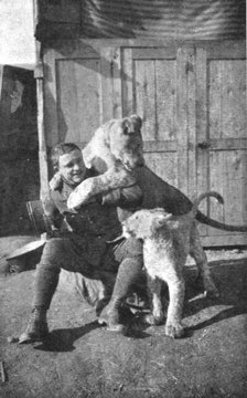 ''Combat Aerien; Deux "poilus" de l'air; Lufbery et ses lionceaux "Wisky" et "Soda" avec..., 1918. Creator: Unknown.
