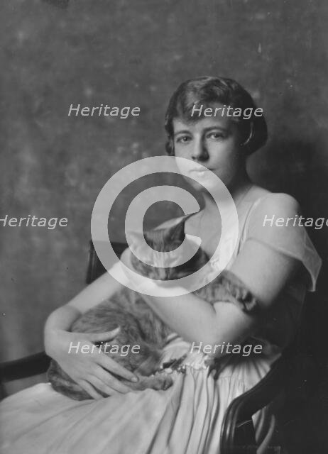 Miss Marjorie Cluett, with Buzzer the cat, portrait photograph, 1917 Dec. Creator: Arnold Genthe.