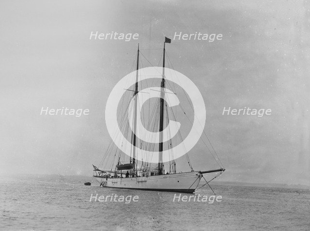 The schooner 'Dwyn-Wen' at anchor, 1920. Creator: Kirk & Sons of Cowes.