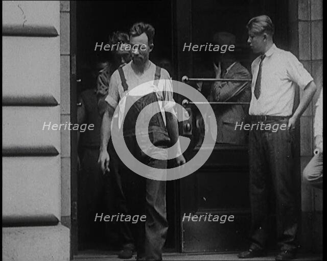 Alcohol Smugglers Coming Out of Court, 1929. Creator: British Pathe Ltd.