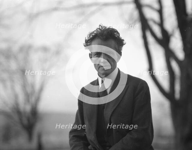 Portrait photograph of Arnold Genthe taken outdoors, between 1911 and 1942. Creator: Arnold Genthe.