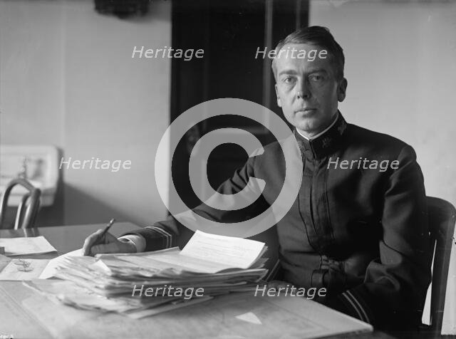 J.P. Auld, U.S.N. at Desk, 1917. Creator: Harris & Ewing.