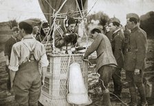 Observer of a kite-balloon testing the telephone before ascending, France, World War I,1916. Artist: Unknown