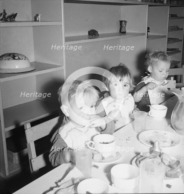 Lunchtime for young migrants at Shafter Camp, California, 1939. Creator: Dorothea Lange.