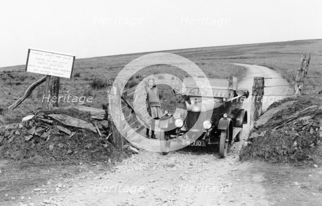 A Morris Bullnose driving through a gateway, early 1920s. Artist: Unknown