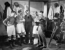 A pause for instruction from film producer Anthony Asquith, Twickenham, London, c1932. Artist: Unknown