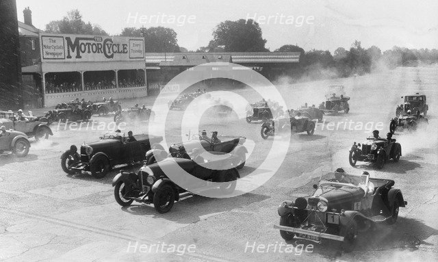 Talbot 105 tourer, Bentley and Lagonda racing at a MCC meeting, Brooklands, Surrey, 1933. Artist: Bill Brunell.