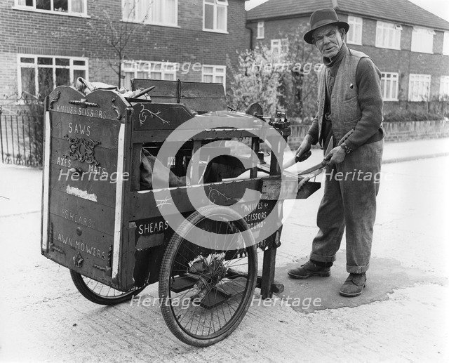Gipsy knife-grinder with his handcart, Horley, Surrey, 1964.