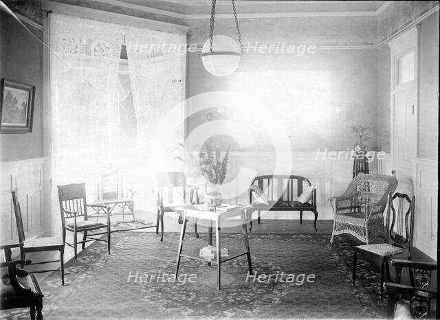 Unknown interior of Victorian family home with fine furniture, brass bed, c1900s.. Creator: Robert Augustus Henry L'Estrange.