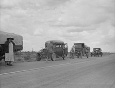 Three related drought refugee families from Oklahoma on highway near Lordsburg, New Mexico, 1937. Creator: Dorothea Lange.