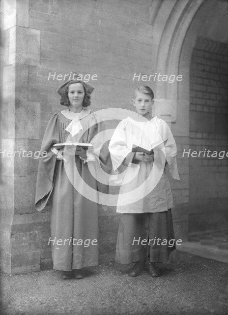 Girl and boy chorister, (Isle of Wight?), c1935. Creator: Kirk & Sons of Cowes.