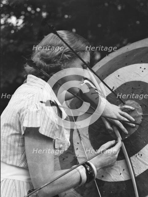 Chase, Diana, Miss, doing archery, 1933 June 22. Creator: Arnold Genthe.