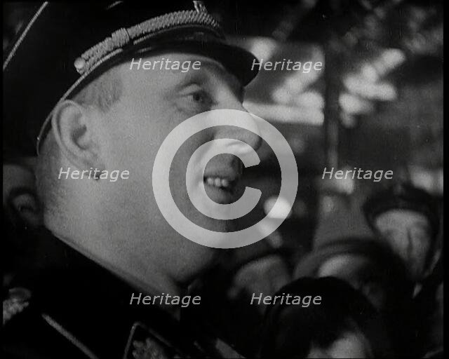 Man in Uniform Surrounded by a Crowd, 1930s. Creator: British Pathe Ltd.