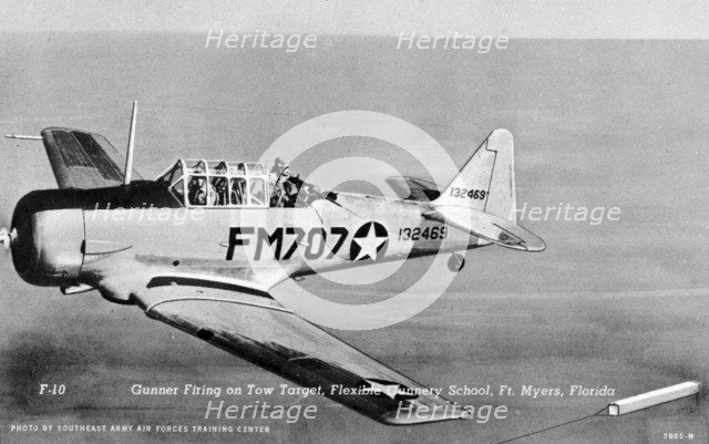 Gunner firing on a tow target, Flexible Gunnery School, Fort Myers, Florida, USA, 1943. Artist: Southeast Army Air Forces Training Center