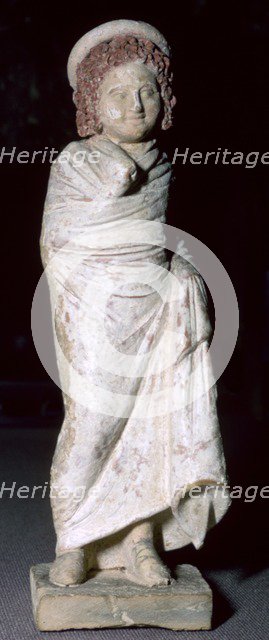 Greek terracotta figure of a boy, said to be from Tanagra, Boeotia, Greece, c300BC- 250BC. Artist: Unknown