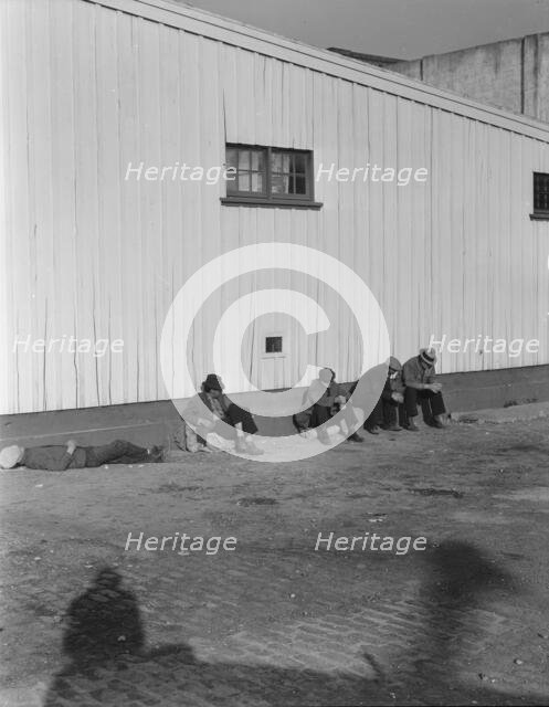On the sun side of the shed, Transient men, San Francisco, California, 1936. Creator: Dorothea Lange.