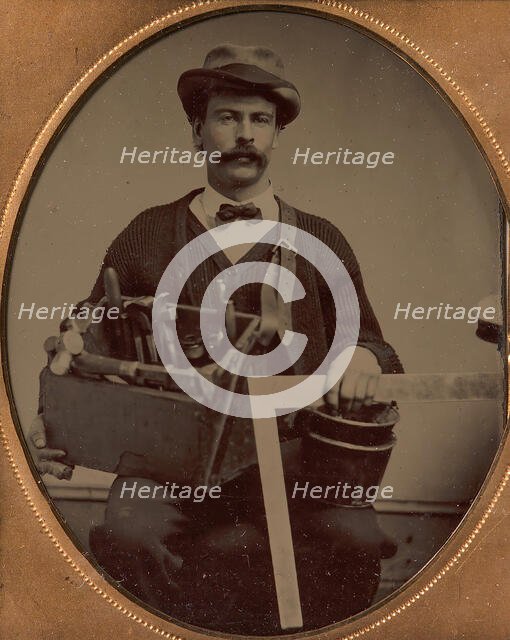 Carpenter Holding a Bag of Tools and a Square, 1880-90s. Creator: Unknown.
