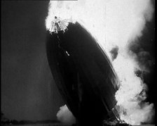 The German Airship, the Hindenburg, its Rear Half Destroyed And Obscured By Smoke With..., 1937. Creator: British Pathe Ltd.