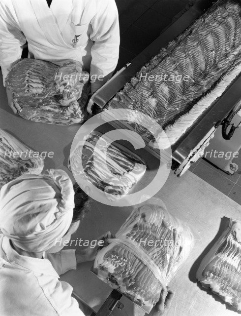 Packing bacon rashers, Danish Bacon Company, Selby, North Yorkshire, 1964. Artist: Michael Walters