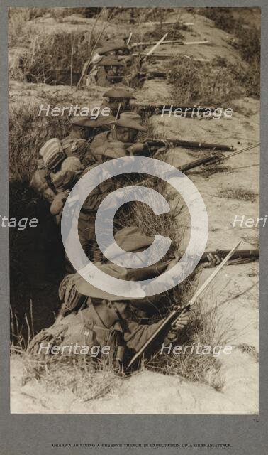 Gharwalis [sic] lining a reserve trench in expectation of a German attack, 1915 (1921). Creator: HD Girdwood.