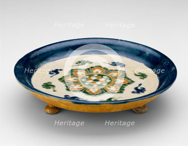 Footed Dish with Lotus Medallion and Cloud Scrolls, Tang dynasty...first half of 8th century. Creator: Unknown.