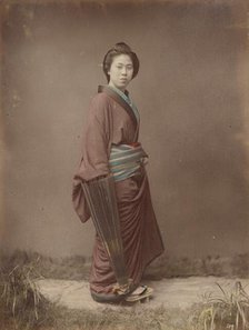 Woman with Closed Umbrella, 1870s-1890s. Creator: Kusakabe Kimbei.