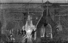 Stephenson's locomotive manufactory at Newcastle-On-Tyne: the steam-hammer, 1864. Creator: Mason Jackson.