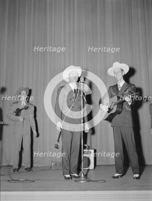 Portrait of Ernest Tubb concert, Carnegie Hall, New York, N.Y., Sept. 18-19, 1947. Creator: William Paul Gottlieb.