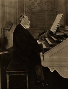 Camille Saint-Saëns (1835-1921) at the Organ, 1913. Creator: Anonymous.