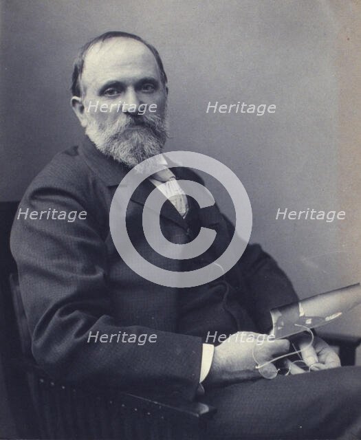 Thomas Hovenden, artist, seated, holding a photograph(?), facing front, half-length portrait, c1895. Creator: Clayton Stone Harris.